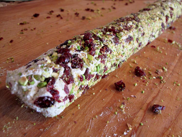 Cheese log on board